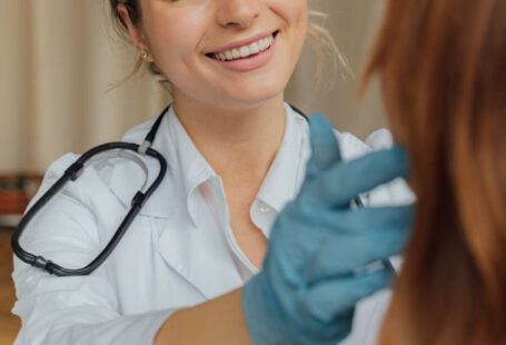 Vaccinations - A Woman in White Long Sleeve Shirt Smiling