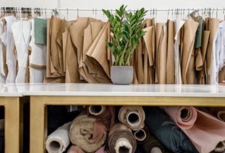 Lifestyle Choices - Rolls of assorted fabrics and textiles and sewing patterns inside tailor atelier