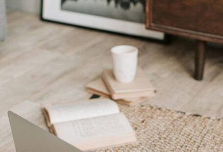 Alzheimer's Research - Laptop and books on floor carpet