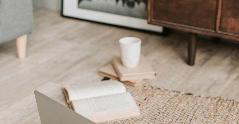 Alzheimer's Research - Laptop and books on floor carpet