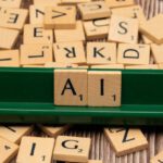 Quantum Computing - A green scrabble board with letters spelling out ai