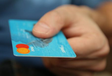 Debt - Person Holding Debit Card