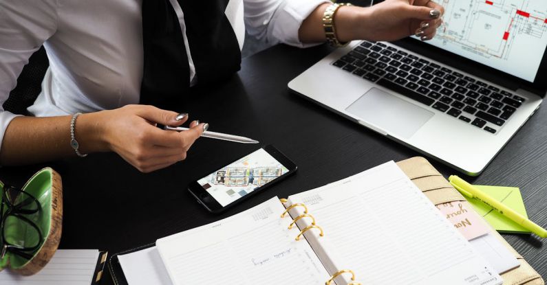 Estate Planning - Person Pointing on the Screen of a Laptop