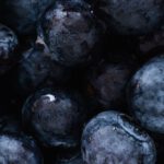 Plant-Based Diets - Top view of delicious sweet and fresh ripe blueberries placed on even surface