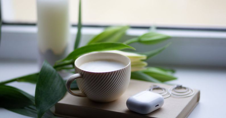 CRISPR Technology - A cup of coffee and a book on a window sill