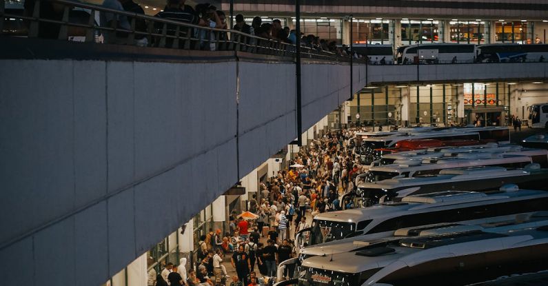 Coaches - A crowded bus station with many people waiting