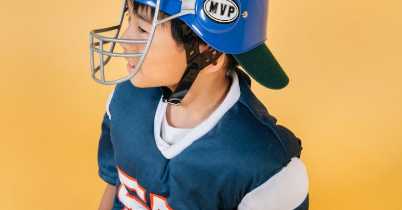 Player Safety - Ethnic boy wearing sportswear of American football player