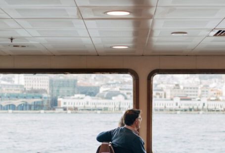 Travel Trends - A man sitting in a chair on a boat