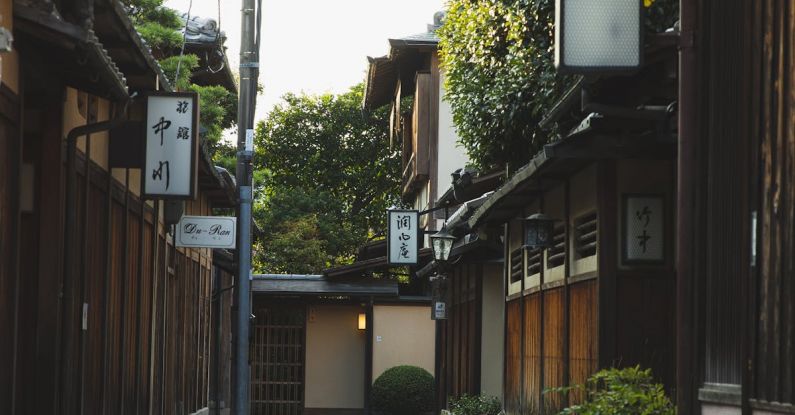 Local Tourism - Narrow alley with small traditional wooden houses in Japan