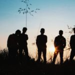 Youth - Silhouette Group of People Standing on Grass Field