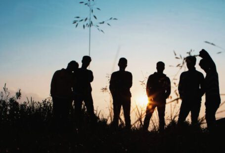 Youth - Silhouette Group of People Standing on Grass Field