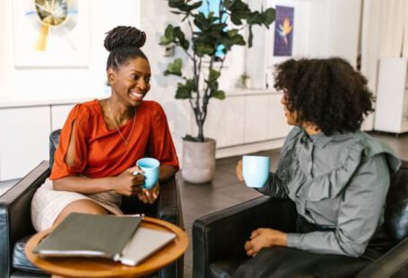 Business Leaders - Women Sitting on the Chair while Having Conversation