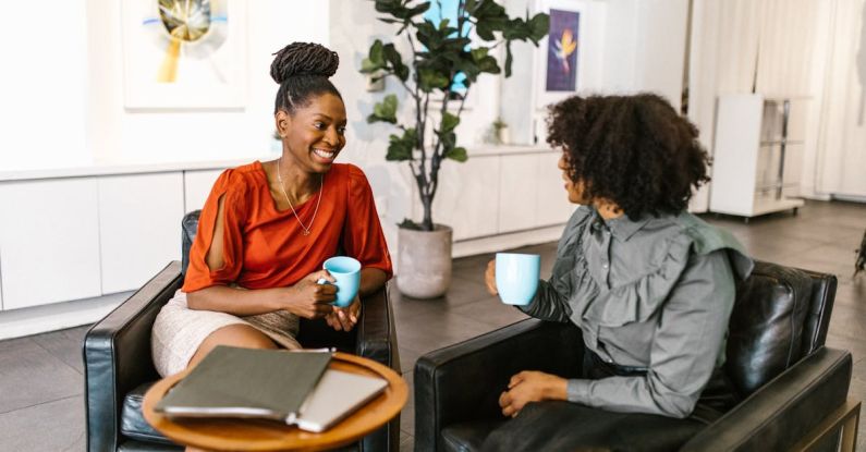 Business Leaders - Women Sitting on the Chair while Having Conversation